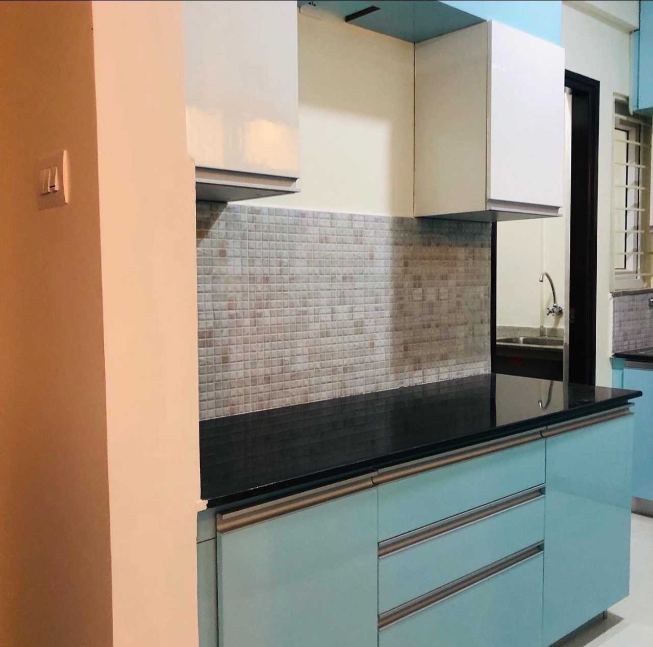 Kitchen counter with black granite and backsplash