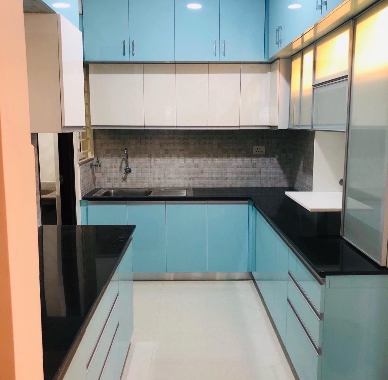 Blue modular kitchen with upper and lower storage