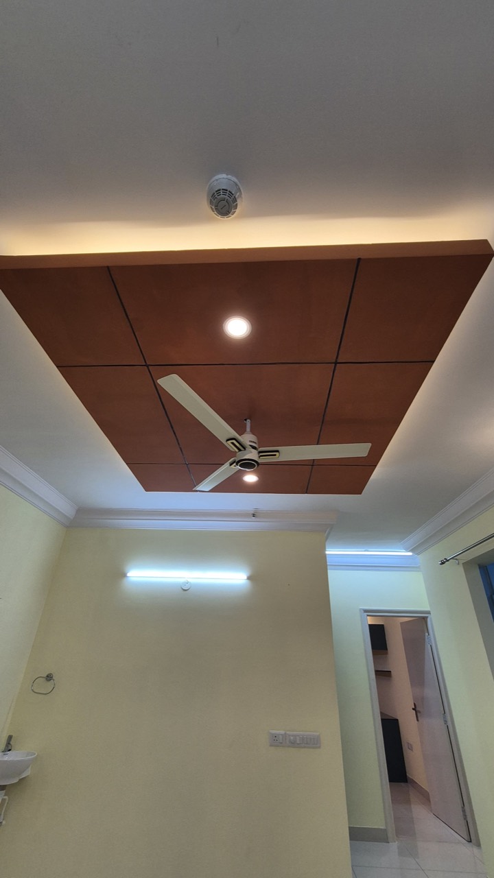 Warm wooden ceiling detail with lighting